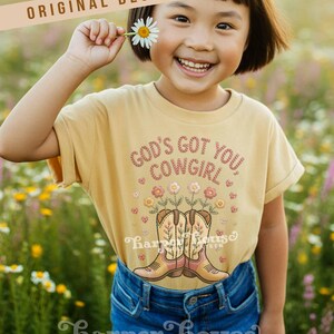 God's got you, cowgirl png western tshirt designs girls toddler png