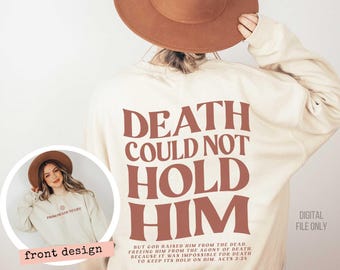 May include: A cream-colored crewneck sweatshirt featuring large, bold, dark red text on the back that reads, "DEATH COULD NOT HOLD HIM," followed by smaller text, "BUT GOD RAISED HIM FROM THE DEAD... ACTS 2:24." The front features a small sun icon and the text "FROM DEATH TO LIFE."