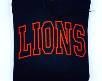 Sudadera universitaria de los Lions / Sudadera con capucha bordada de los Lions / Sudadera de cuello redondo con el espíritu escolar / Ropa de equipo / Sudadera para el día del partido / Camiseta personalizada de los Lions