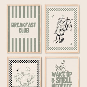 May include: Four framed art prints with a breakfast theme. The prints feature illustrations of a coffee mug, a pot with a chef's hat, and coffee beans. One print reads "Breakfast Club" and another says "Wake up & smell the coffee."
