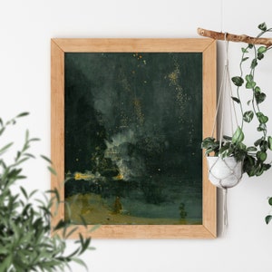 May include: A framed painting of a dark green night sky with white and gold fireworks exploding over a body of water. The painting is in a wooden frame.