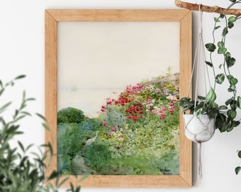 Könnte beinhalten: Ein gerahmtes Aquarellbild einer Küstenlandschaft mit einem Weg, der durch ein Feld mit rosa und roten Blumen führt. Das Bild ist vor einem blauen Himmel und einem ruhigen Meer platziert.