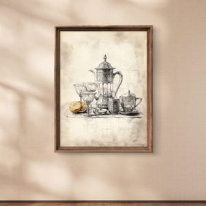 May include: A framed black and white sketch of a tea set, including a teapot, cups, and a saucer, with a lemon slice. The artwork is in a wooden frame, creating a vintage aesthetic.
