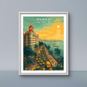 May include: A framed art print of Mumbai, India. The artwork depicts a vibrant street scene with yellow buses, palm trees, and a large building with a red dome. The sky transitions from teal to yellow, with the text "MUMBAI INDIA" at the top.