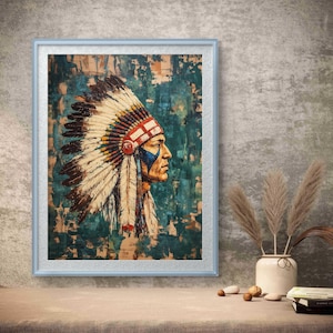 Puede incluir: Obra de arte enmarcada que presenta el perfil de un jefe nativo americano con un tocado de plumas. La pintura tiene un fondo verde azulado y marrón con un marco azul claro. La cara del jefe está pintada con detalles azules y rojos.