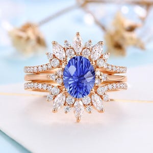Firework Cut Lab Cornflower Sapphire Bridal Set - 14K Gold Oval Sapphire Engagement Ring Set | Stackable Moissanite Enhancer Wedding Band
