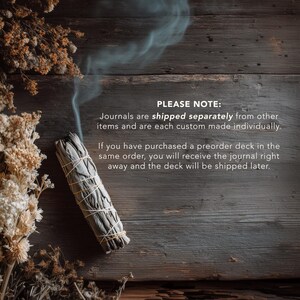 May include: A bundle of white sage, bound with twine, emits a wisp of smoke against a dark wood background. Dried flowers are arranged on the left side. Text reads: "PLEASE NOTE: Journals are shipped separately..."
