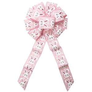 May include: Pink bow with white bunny faces and pink glitter. The bow is made of ribbon and has a loop in the center. The tails of the bow are long and flowing.