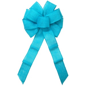 May include: A large turquoise burlap bow with two long tails. The bow is tied in a classic style with a center loop and two side loops.