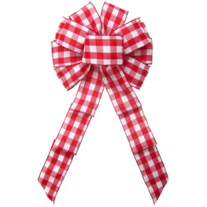 May include: A red and white gingham bow with a large center loop and two long tails.