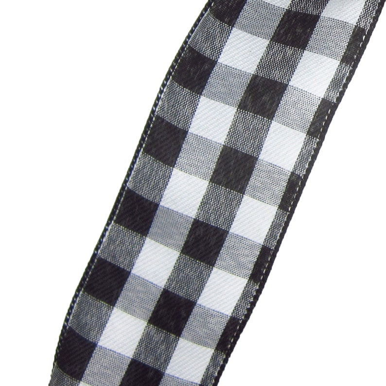 May include: Black and white checkered ribbon with a satin finish. The ribbon is approximately 2.5 inches wide.