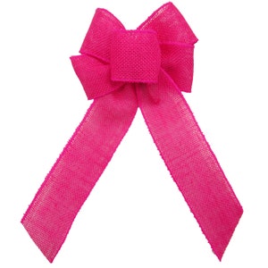 May include: A large, bright pink burlap bow with a center loop. The bow is made of a textured, woven fabric.