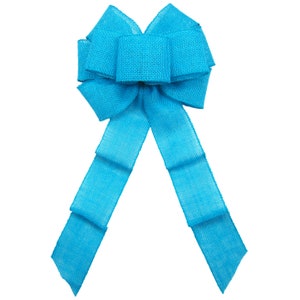 May include: A large turquoise blue burlap bow with a center loop and two long tails.