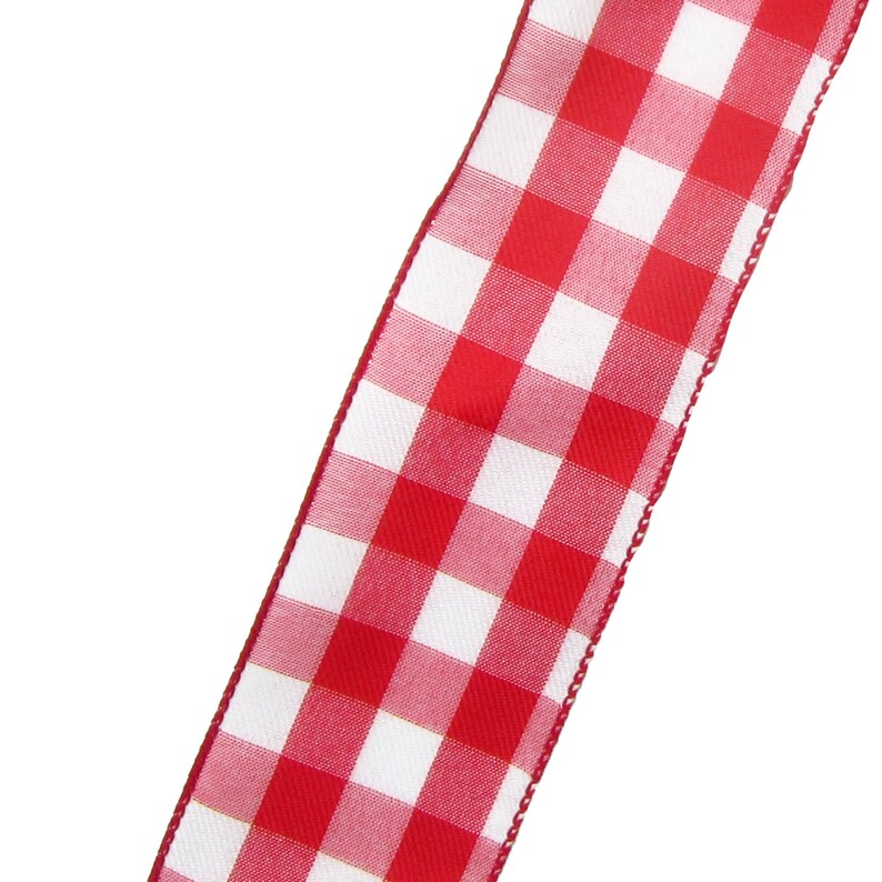 May include: Red and white gingham ribbon with a white background and red squares. The ribbon has a slightly frayed edge.