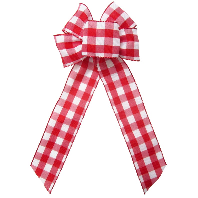 May include: A red and white gingham bow with a large center loop. The bow is made of a soft, textured fabric.