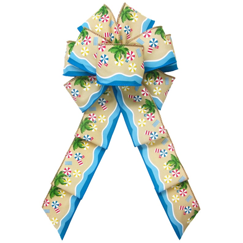 May include: A large, decorative bow made of tan and blue ribbon. The tan ribbon features a repeating pattern of palm trees, beach umbrellas, and beach chairs. The blue ribbon has a wavy pattern. The bow is tied in a large, symmetrical knot.