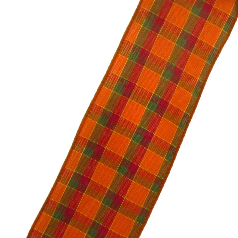 May include: Orange, green, and red plaid ribbon. The ribbon has a woven texture.