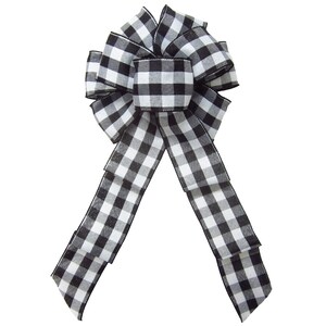May include: A black and white checkered bow with a long tail. The bow is made of a soft, woven fabric and is perfect for adding a touch of farmhouse style to any decor.