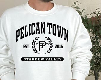 Stardew Valley PNG: Sudadera acogedora de videojuegos Pelican Town, regalo para gamer, regalo de Stardew Valley, idea de regalo para gamer, camiseta de Pelican Town
