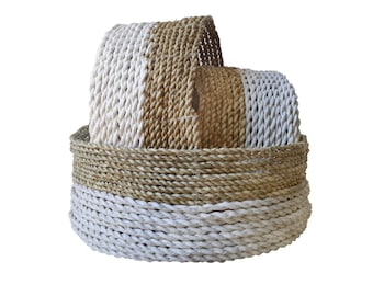 White and beige storage baskets in sea rush