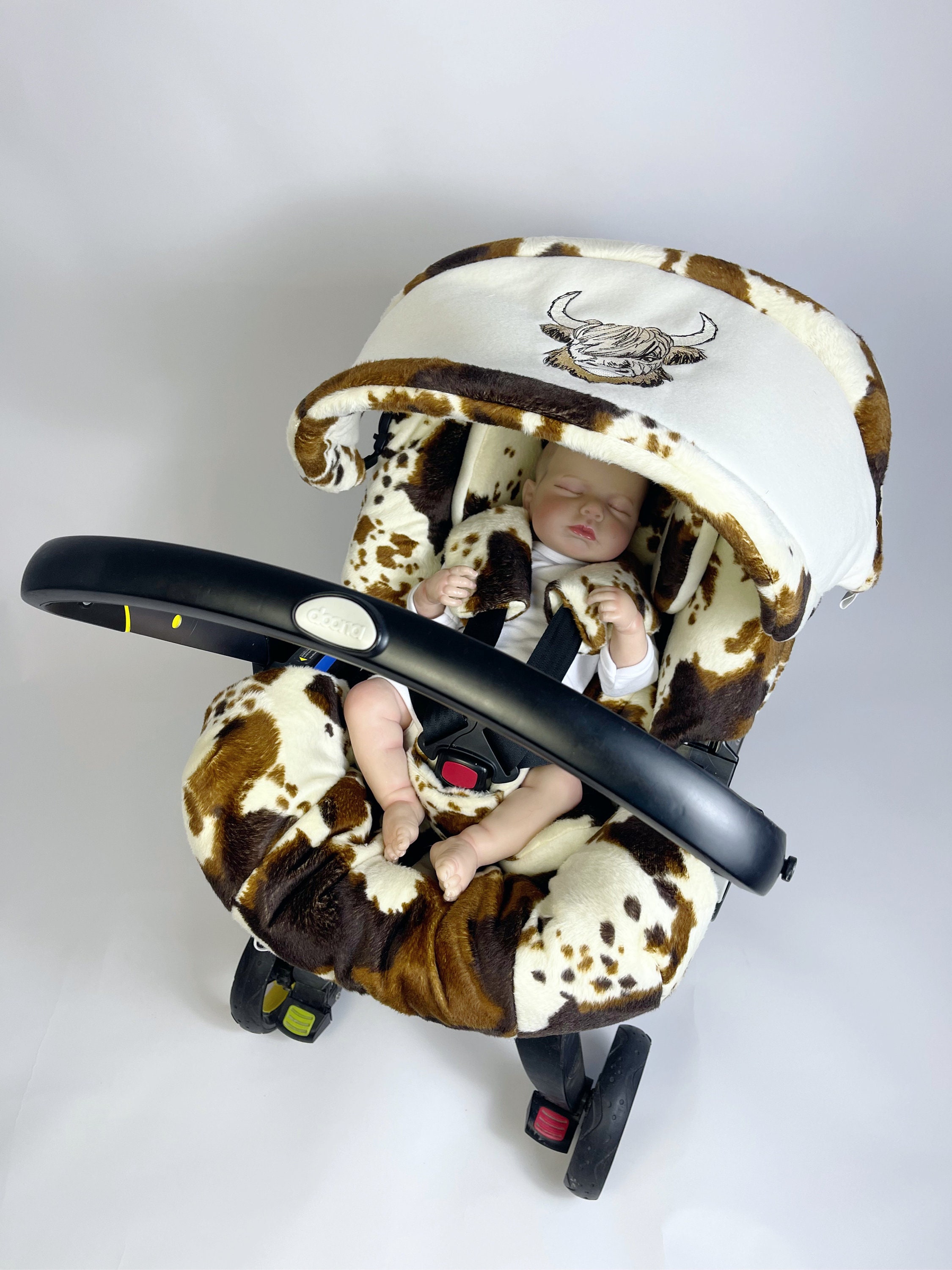 Cow print car seat and stroller top