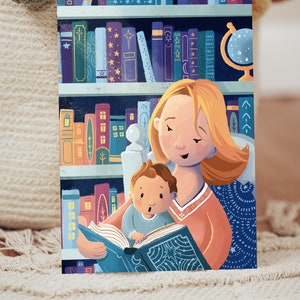 May include: A woman with blonde hair reads a book to a child sitting on her lap. The woman is wearing a red sweater and the child is wearing a blue shirt. The book has a blue cover with stars and a crescent moon. The background is a bookshelf with many books and a globe.