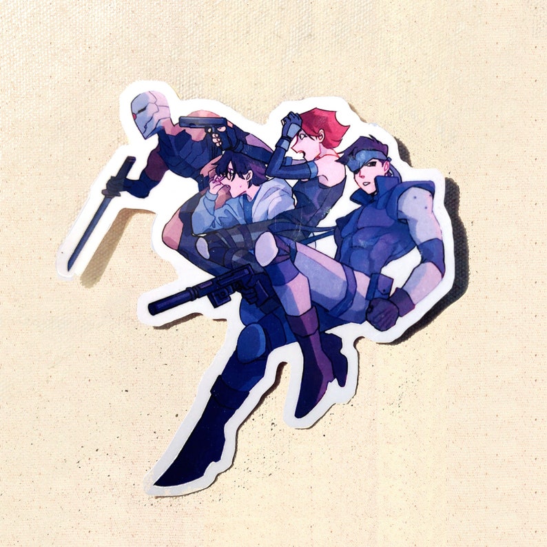 May include: A sticker featuring a group of four stylized characters in shades of blue, gray, and purple. One character holds a sword, another a gun. The sticker has a white border and is set against a beige background.