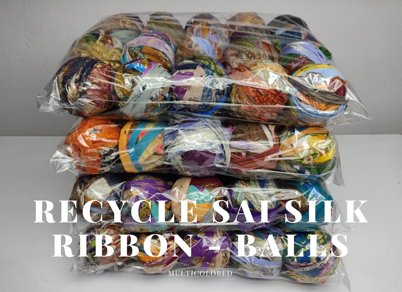 Rows of packaged assorted sari silk ribbon balls showing varied prints and colors