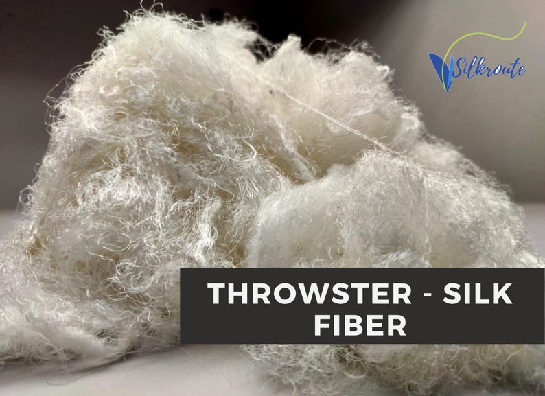 Close view of white throwster silk waste fiber prepared for spinning, blending and dyeing.