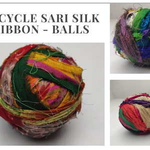 Close view of a wound sari silk ribbon ball with green, orange and pink fabric strips