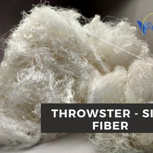 Another view of white throwster silk fiber with soft, fluffy reclaimed silk texture.