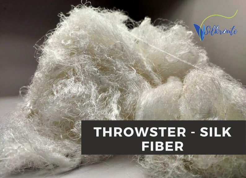 Another view of white throwster silk fiber with soft, fluffy reclaimed silk texture.