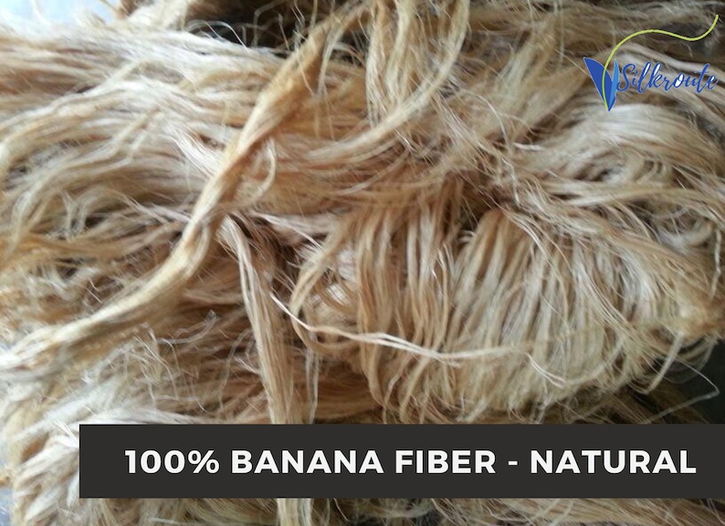 Close view of natural beige banana fiber bundles with visible long strands and soft twists.
