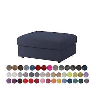 May include: A navy blue fabric ottoman with a rectangular top and a storage compartment. The ottoman is available in a variety of colors and fabrics.