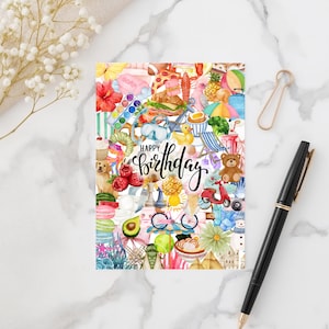 May include: A colorful birthday card with a collage of watercolor illustrations. The card features images of food, flowers, and leisure items, with the words "Happy Birthday" in elegant script. A pen and paperclip are on the marble surface.