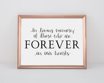 May include: A framed print with a rose gold frame and a white background. The print features black text that reads "In loving memory of those who are FOREVER in our hearts."