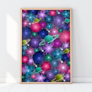 May include: A framed print featuring a colorful abstract design of flowers and planets. The flowers are in shades of pink, purple, blue, and green, and the planets are surrounded by rings. The background is a dark blue with a subtle sparkle effect.