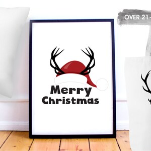 May include: A set of three Christmas-themed designs featuring a reindeer wearing a Santa hat. The designs are printed on a pillow, tote bag, and framed print. The print says "Merry Christmas".