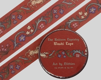 May include: A roll of washi tape and three strips of the same tape, featuring a terracotta red background with a repeating pattern of cream-colored unicorns, blue and pink flowers, and green foliage. The label reads The Unicorn Tapestry Washi Tape.