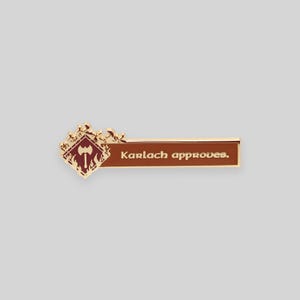 May include: Gold and red enamel pin with a stylized axe and flames, and the text "Karlach approves."