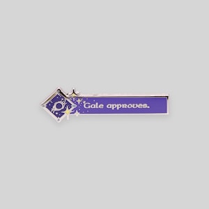 May include: Purple enamel pin with a silver border. The pin features a stylized star with a circle inside and the text "Gale approves."
