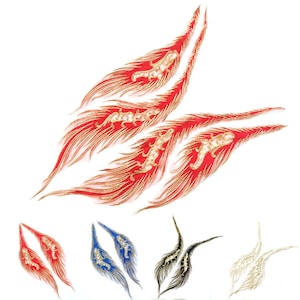 May include: Feather-shaped appliques in red, gold, blue, black, and white. The red feathers have gold accents and a gold animal design. The other feathers have gold or silver accents. These appliques are suitable for clothing or craft embellishments.