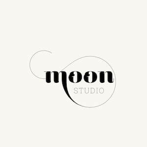 May include: Black and white logo design for a business called "moon studio". The word "moon" is stylized with a curved line that forms a circle around the word.