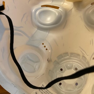 May include: A white plastic mask with a black elastic band. The mask has a detailed design and is intended as a collectible for ages 15 and up. The text on the mask reads: "Recommended as a collectible for 15+ years. Variations that require an unrestricted view do not use or wear near heat or open flame."