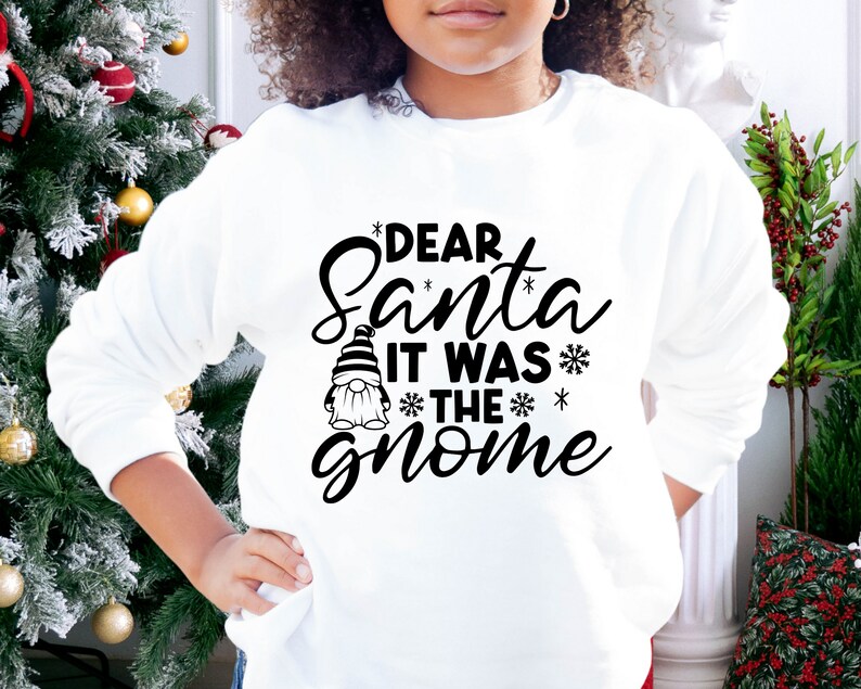 May include: White sweatshirt with a black graphic that says "Dear Santa It Was The Gnome" with a small gnome illustration.