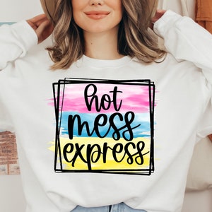 May include: White sweatshirt with a graphic design of a colorful watercolor background with the text "hot mess express" in black.