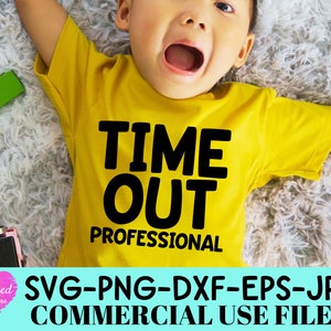 May include: A mustard yellow t-shirt featuring the bold black text TIME OUT PROFESSIONAL printed on the front. The shirt is worn by a child lying down, with the design clearly visible across the chest area of the garment.