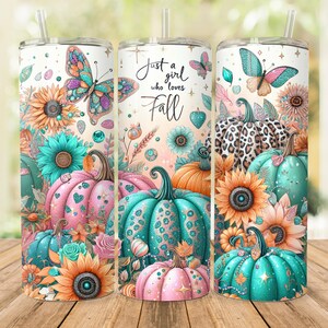 May include: A tumbler with a design featuring pumpkins, butterflies, sunflowers, and the text "Just a girl who loves Fall". The design is in shades of pink, teal, orange, and gold.