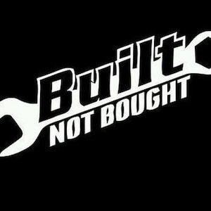 May include: White wrench with the text "Built Not Bought" on a black background.