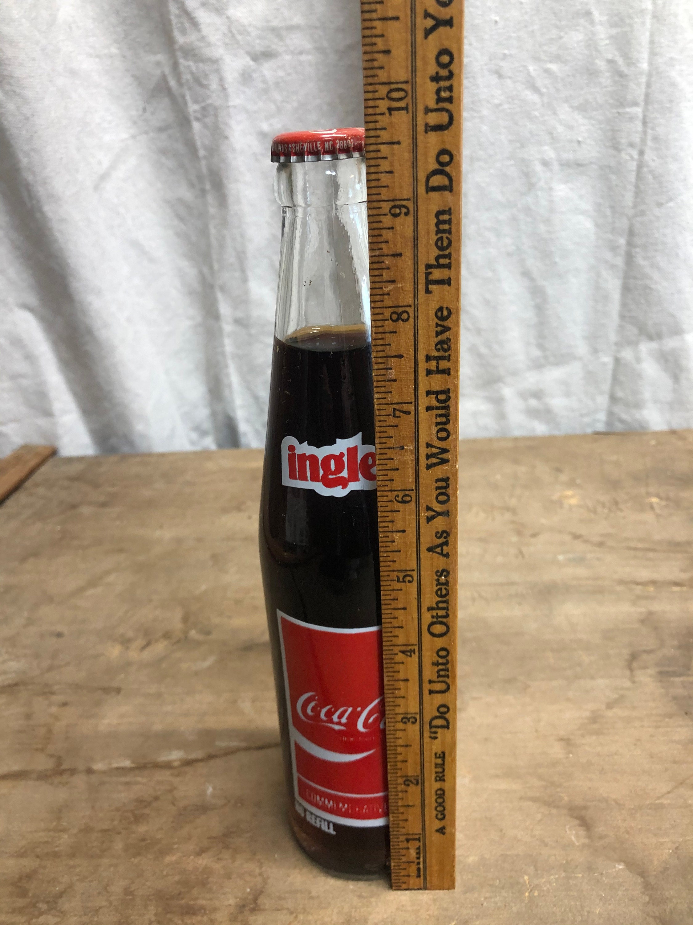 10 OZ COCA COLA COMMEMORATIVE BOTTLE - 1985 INGLES 100TH STORE OPENING